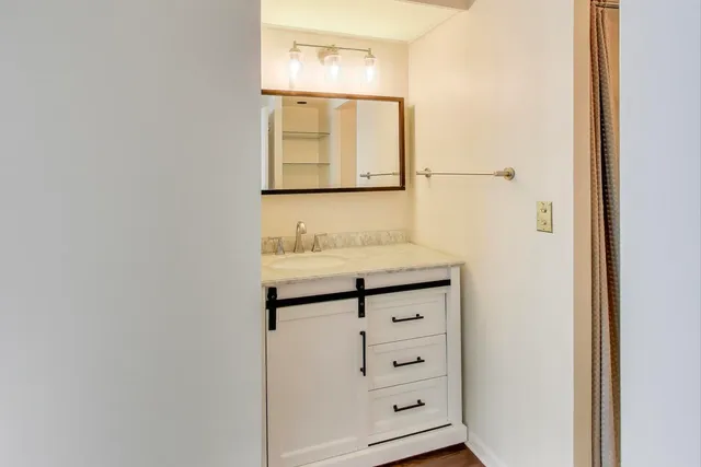 a bathroom with a shower and toilet