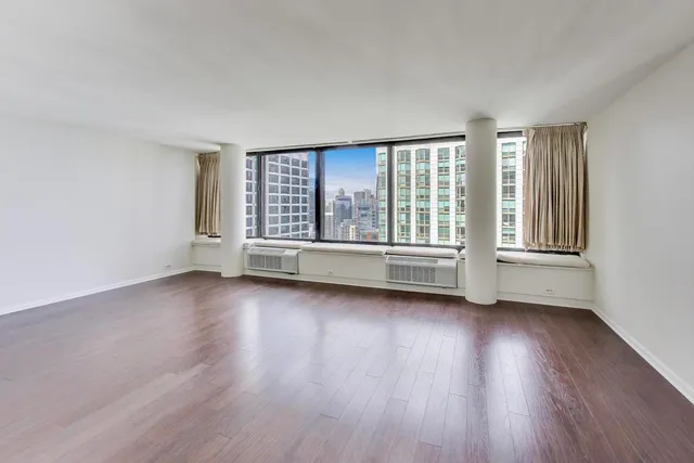 a view of a livingroom with wooden floor