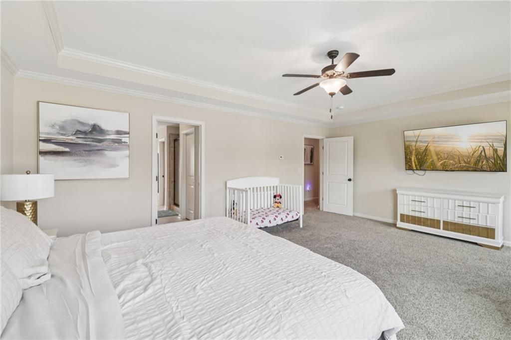 1120 Red Bud Circle Villa Rica, GA 30180 - Photo 13 of 31 a bedroom with a bed and a painting on the wall