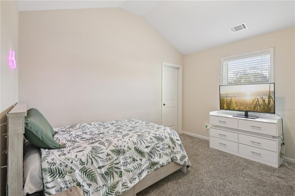 1120 Red Bud Circle Villa Rica, GA 30180 - Photo 17 of 31 a bedroom with a bed and a window