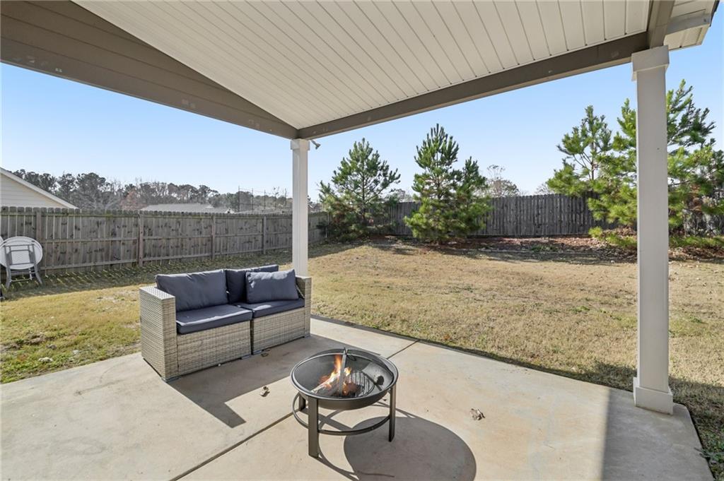 1120 Red Bud Circle Villa Rica, GA 30180 - Photo 22 of 31 a view of roof deck with couches and wooden floor