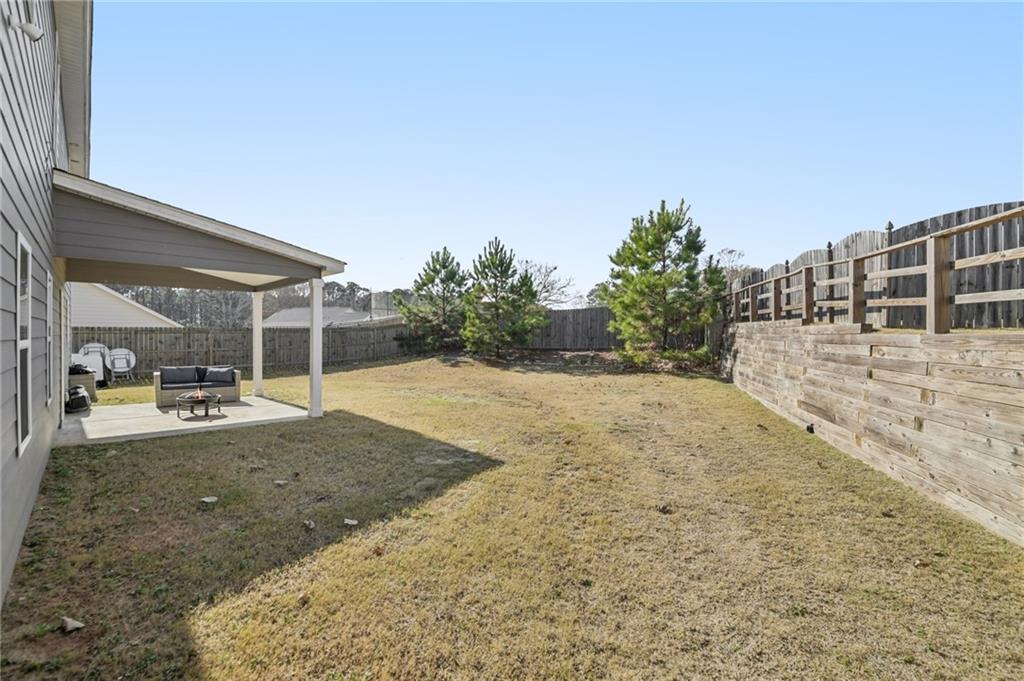 1120 Red Bud Circle Villa Rica, GA 30180 - Photo 24 of 31 a view of backyard with large trees