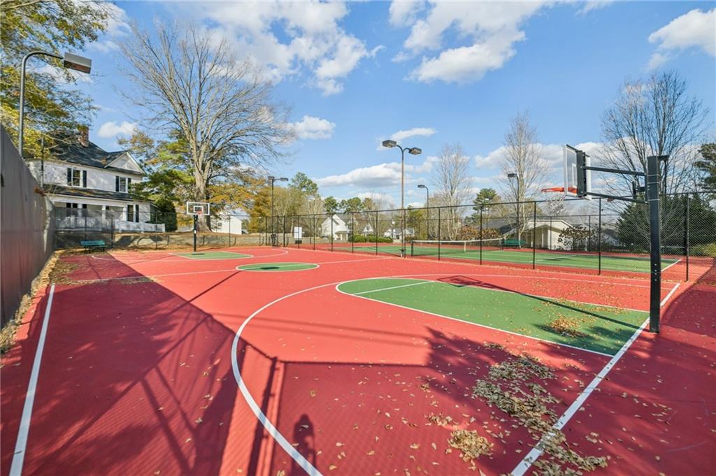 1120 Red Bud Circle Villa Rica, GA 30180 - Photo 29 of 31 a view of a tennis ground with large trees