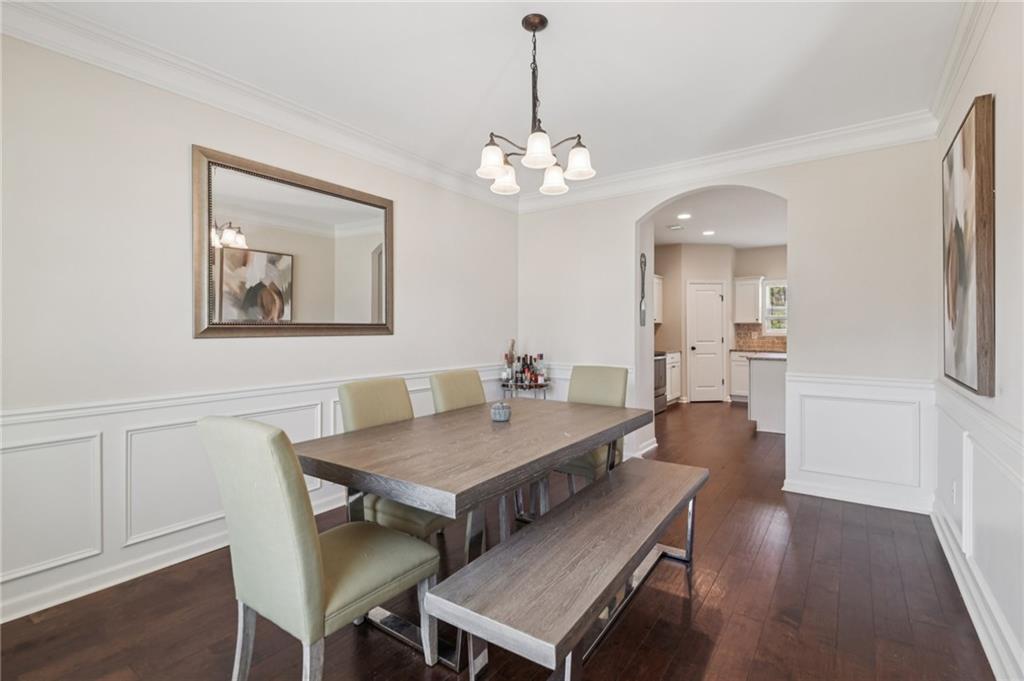 1120 Red Bud Circle Villa Rica, GA 30180 - Photo 3 of 31 a view of a dining room with furniture and wooden floor