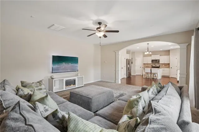 a living room with furniture and a flat screen tv