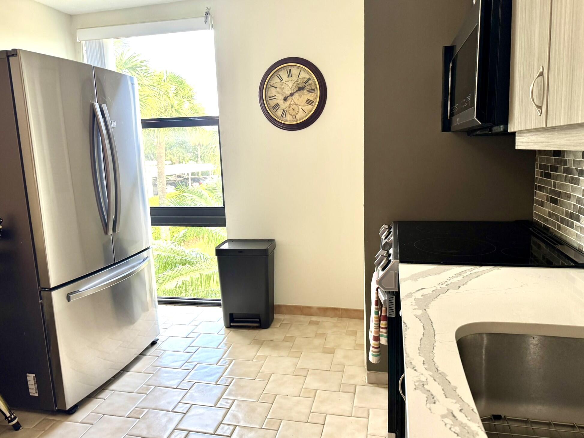 1629 Riverview Road, Unit 221 Deerfield Beach, FL 33441 - Photo 4 of 31 Kitchen side view