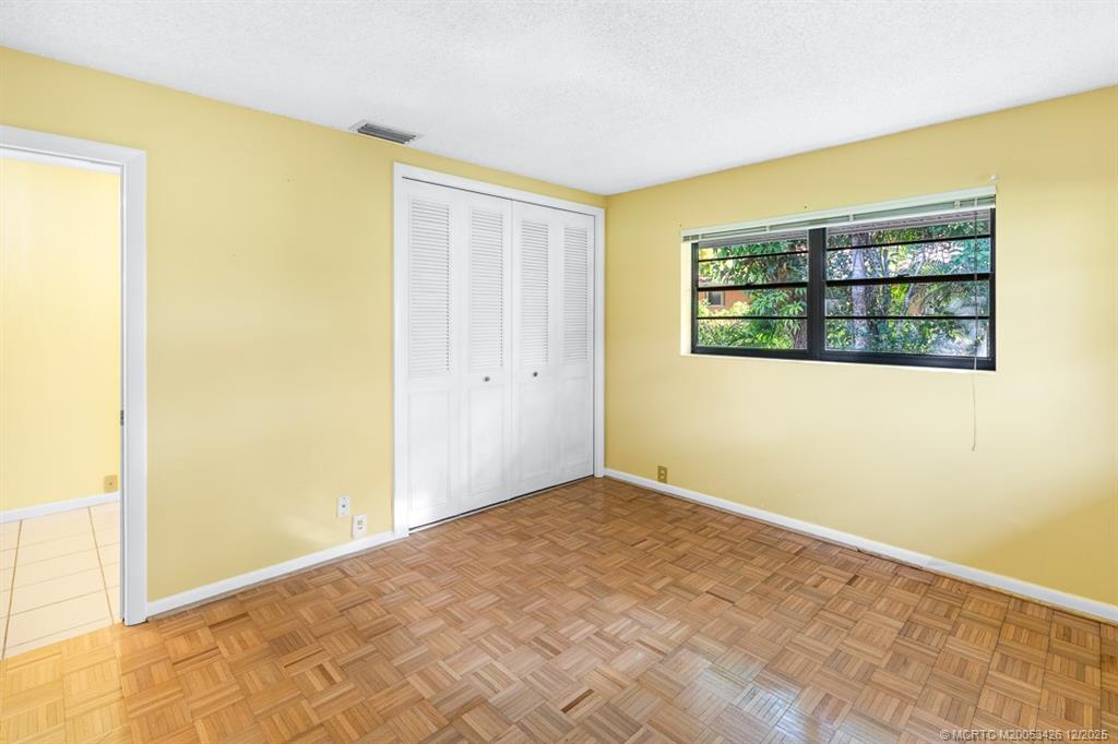 3181 Southeast Fairway West Stuart, FL 34997 - Photo 43 of 64 an empty room with windows