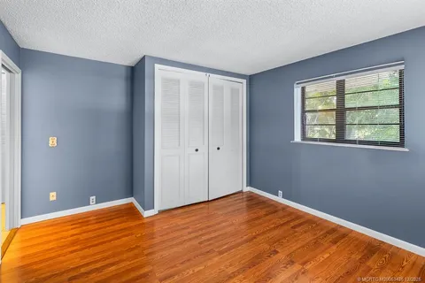 a view of yard with swimming pool and green space