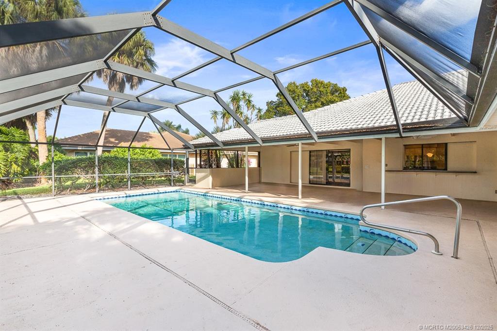 3181 Southeast Fairway West Stuart, FL 34997 - Photo 56 of 64 a view of a house with a swimming pool