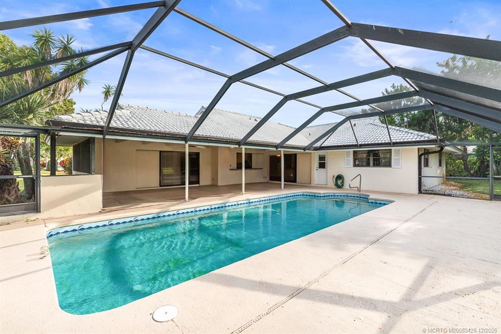 3181 Southeast Fairway West Stuart, FL 34997 - Photo 57 of 64 a view of a house with a swimming pool