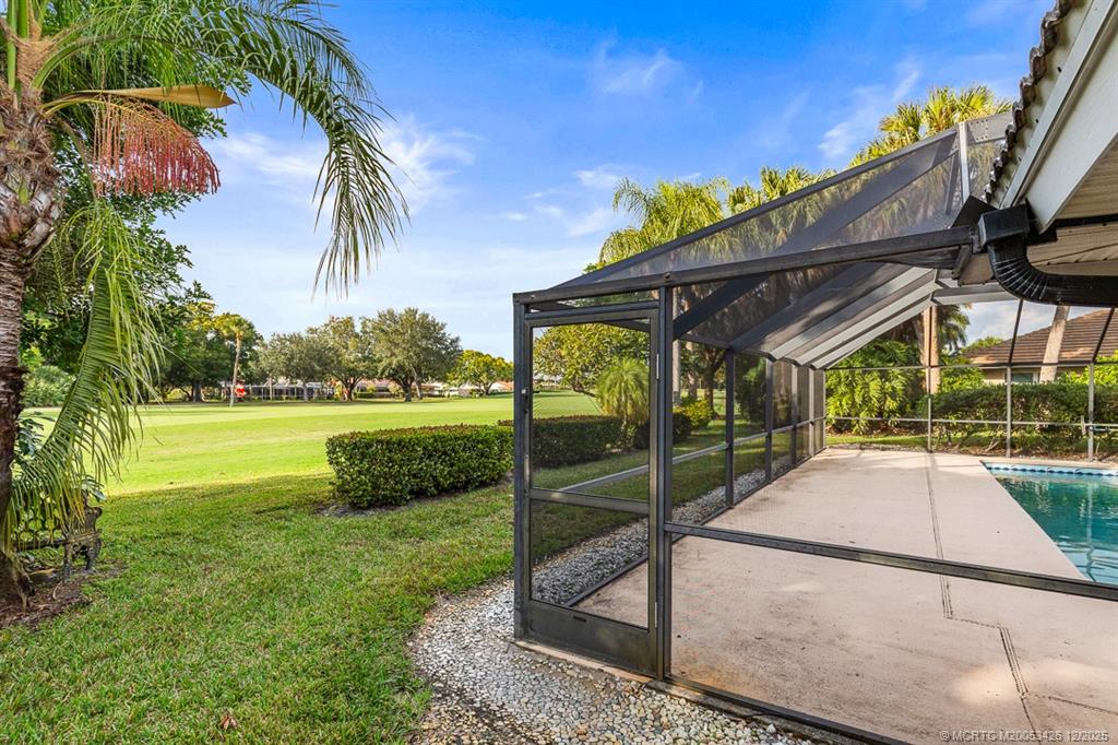 3181 Southeast Fairway West Stuart, FL 34997 - Photo 58 of 64 a view of a backyard with a patio