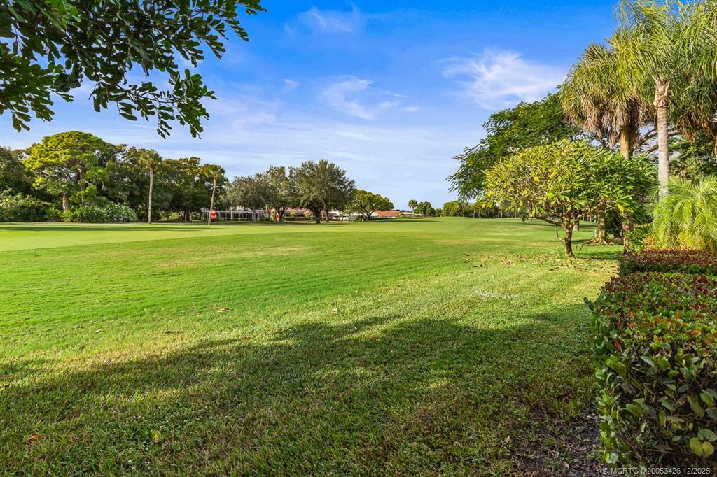 3181 Southeast Fairway West Stuart, FL 34997 - Photo 63 of 64 a view of a big yard with lots of green space