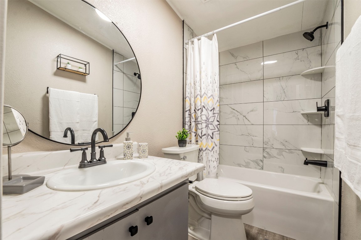 113 Sunset Ridge Bastrop, TX 78602 - Photo 11 of 15 a bathroom with a sink a toilet and a mirror