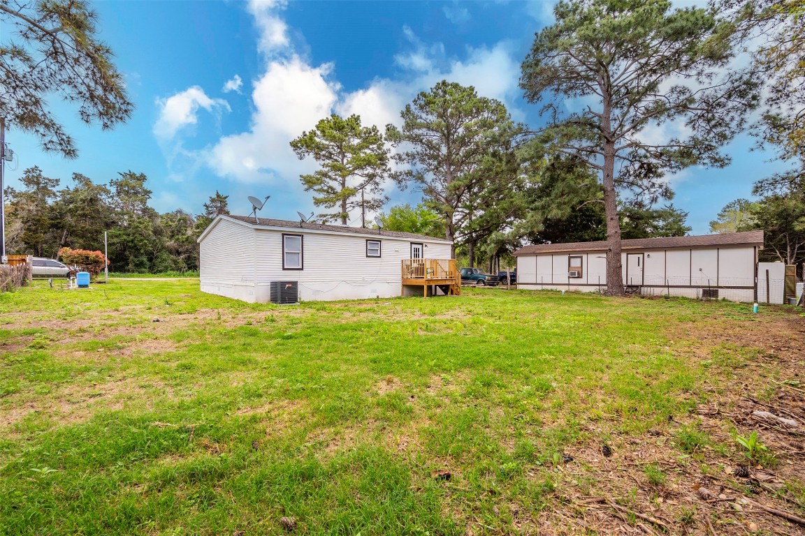 113 Sunset Ridge Bastrop, TX 78602 - Photo 15 of 15 a front view of a house with garden