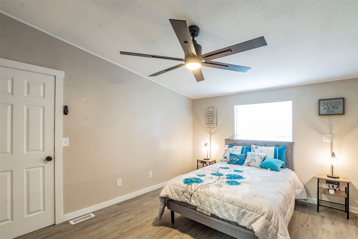 113 Sunset Ridge Bastrop, TX 78602 - Photo 7 of 15 a bedroom with a bed and a ceiling fan