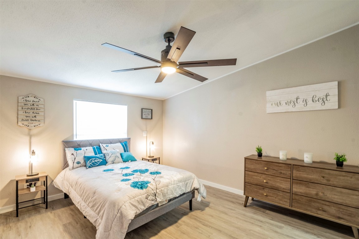 113 Sunset Ridge Bastrop, TX 78602 - Photo 8 of 15 a bedroom with a bed and a ceiling fan