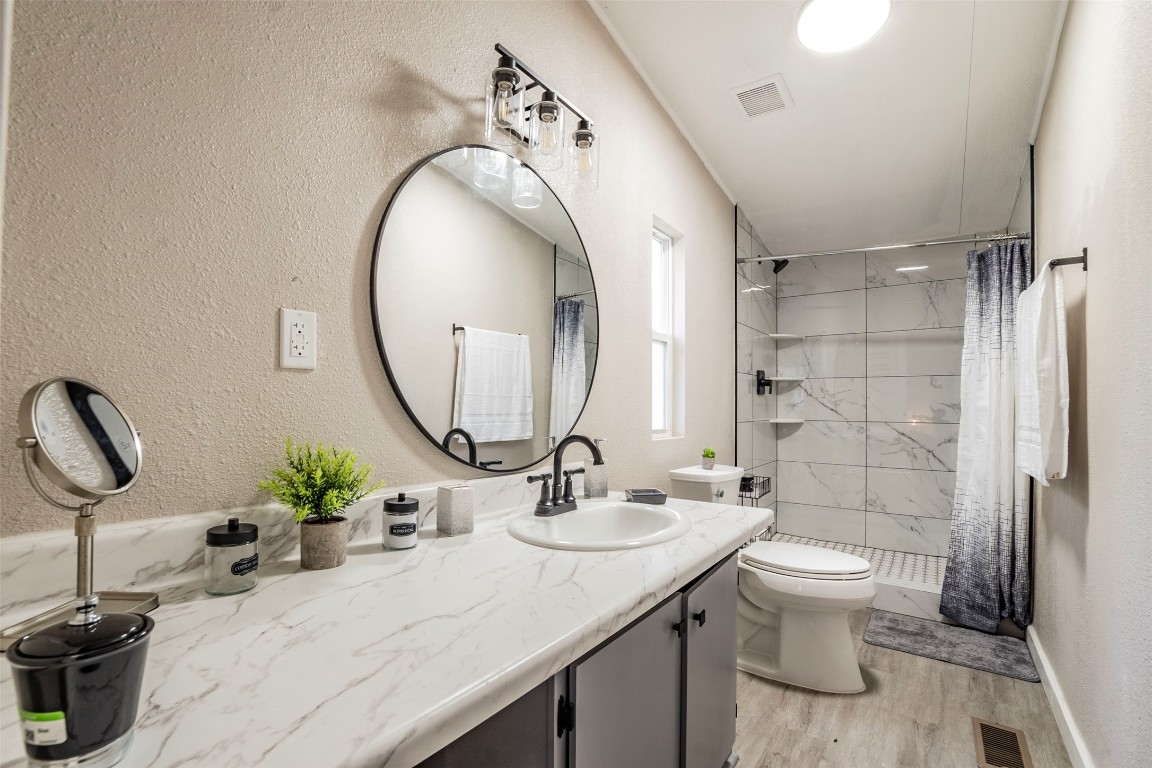 113 Sunset Ridge Bastrop, TX 78602 - Photo 9 of 15 a bathroom with a sink toilet and shower
