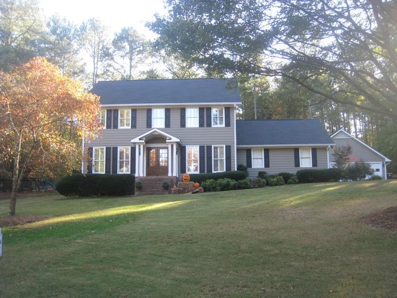 108 Valley Brook Drive Rome, GA 30161 - Photo 1 of 1 a front view of a house with a garden and trees