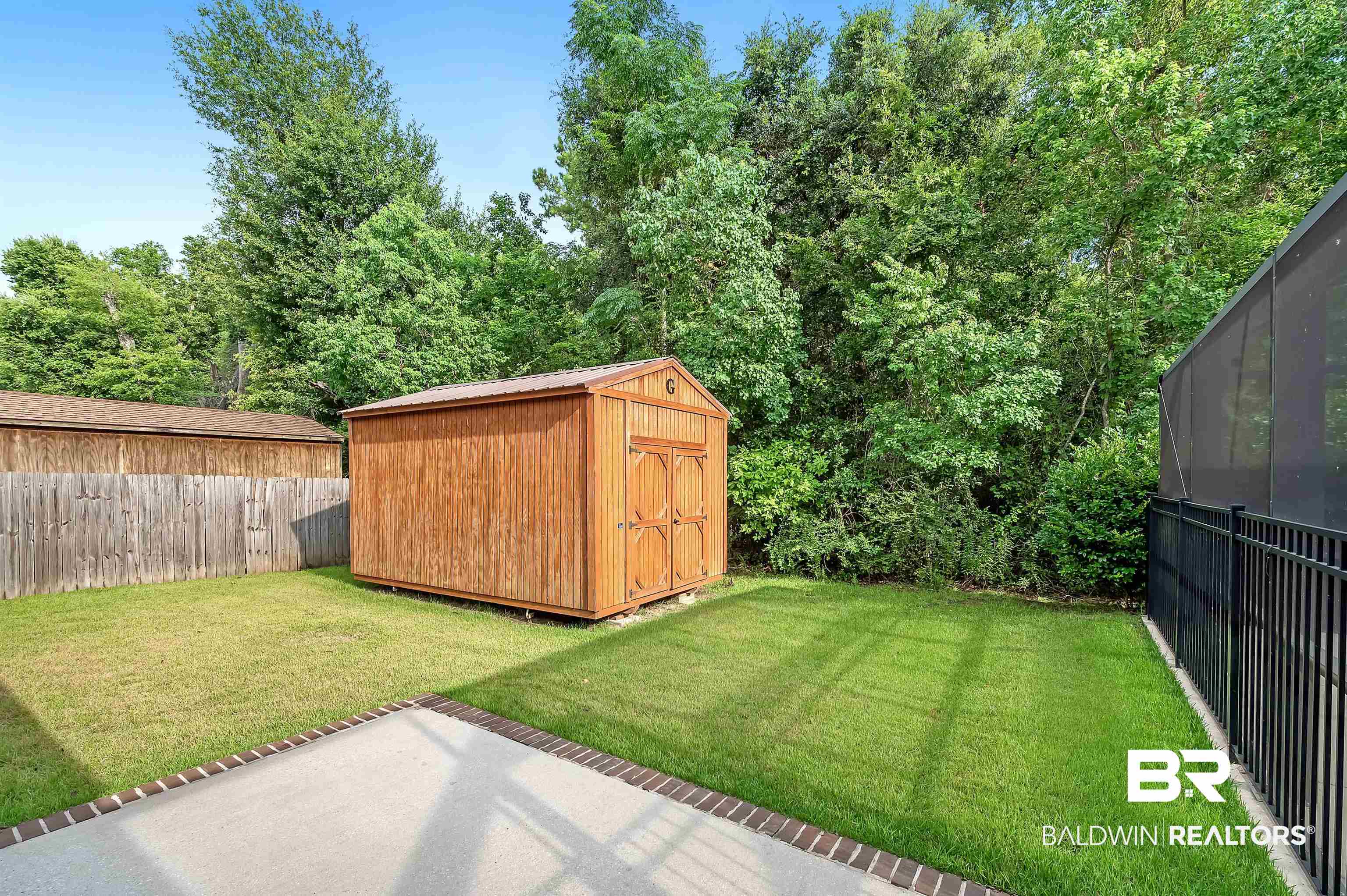 1086 Melbourne Court Foley, AL 36535 - Photo 41 of 43 View of yard with a storage shed