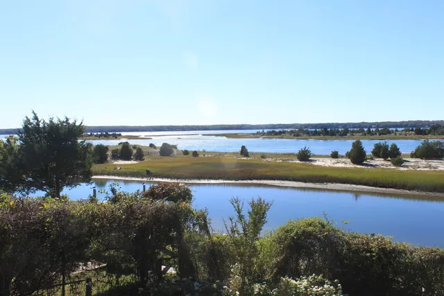 a view of an ocean and city