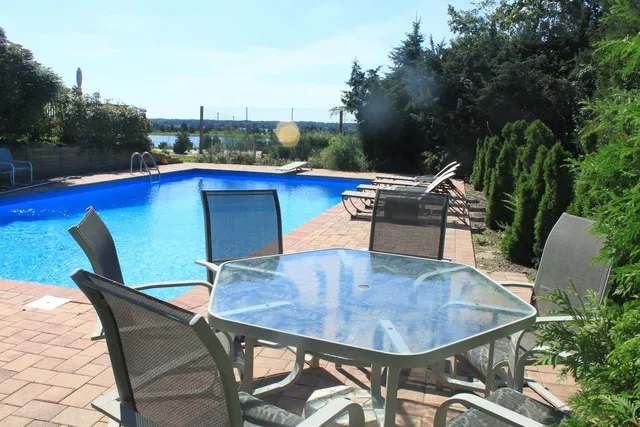a view of a chairs and table in the patio