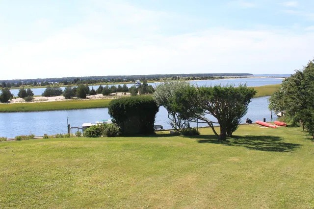 a view of a lake with a building in the background