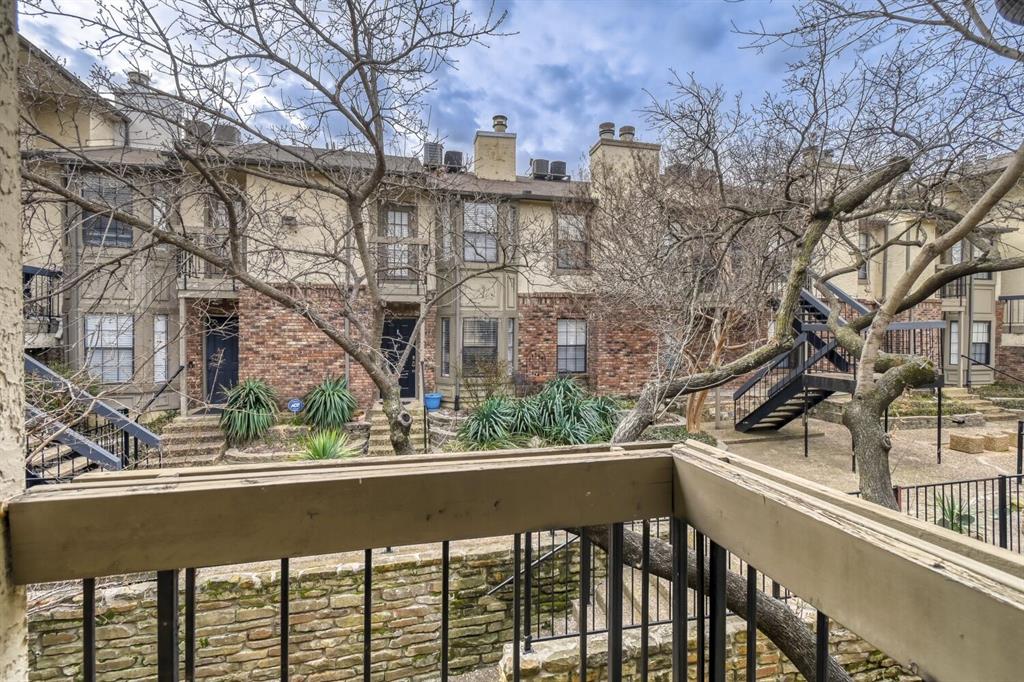 8750 Park Lane, Unit 142 Dallas, TX 75231 - Photo 14 of 17 Large Balcony just off the primary bedroom upstairs overlooking the courtyard.