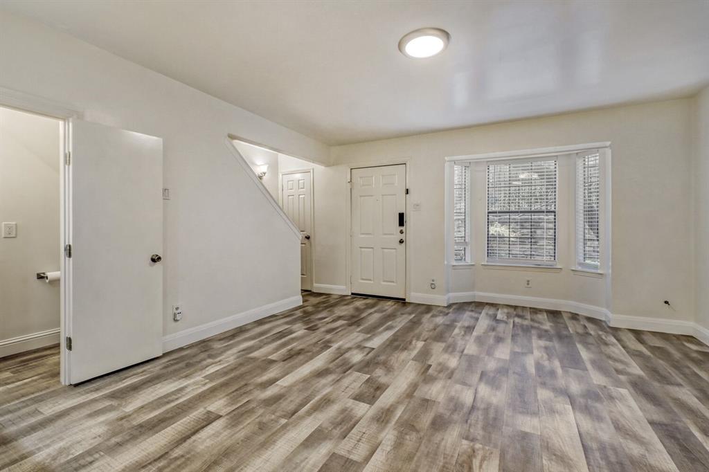 8750 Park Lane, Unit 142 Dallas, TX 75231 - Photo 5 of 17 Entryway with baseboards and light wood-style flooring