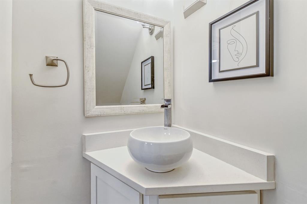 8750 Park Lane, Unit 142 Dallas, TX 75231 - Photo 6 of 17 Half bathroom featuring vanity