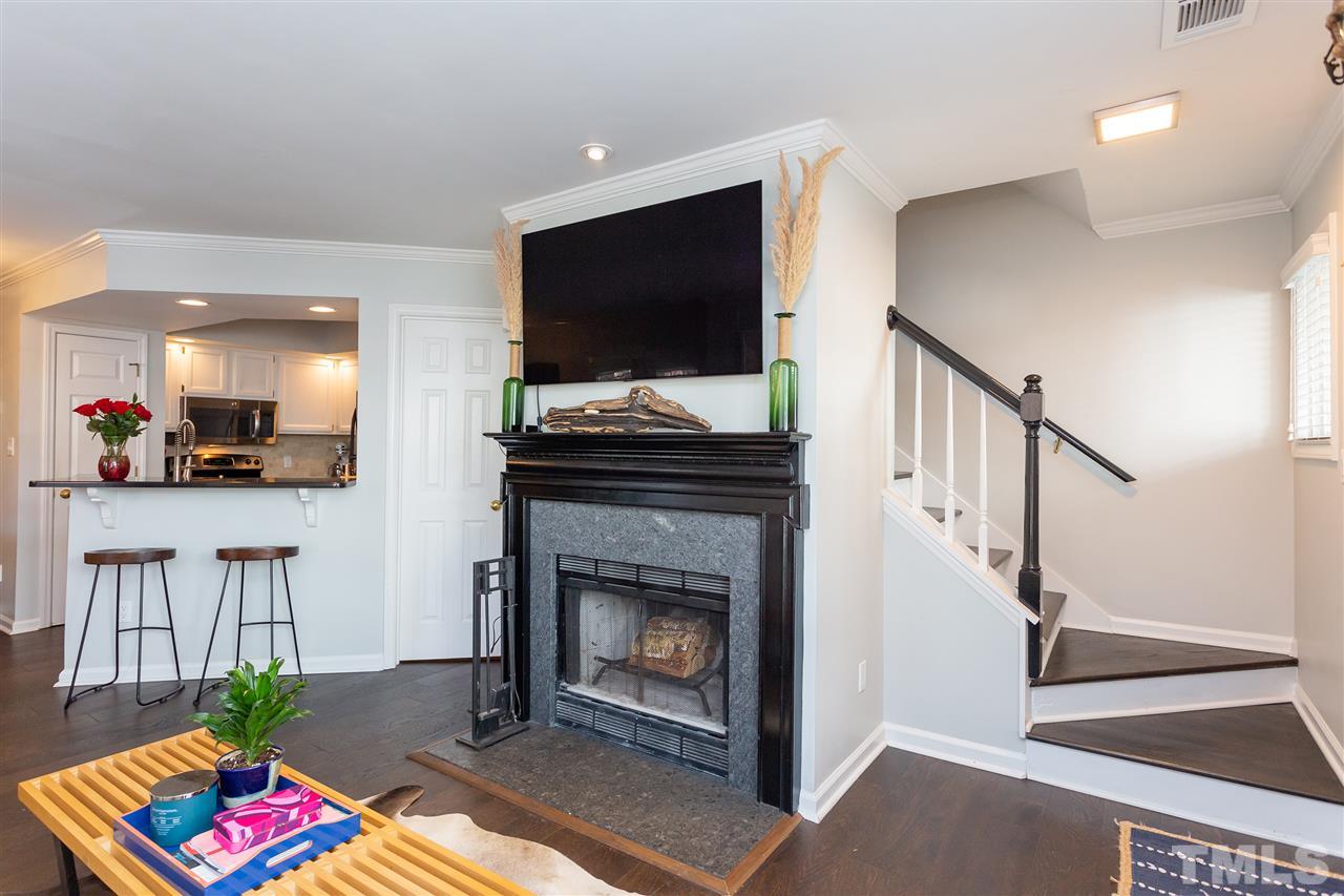 1462 Barton Pl Drive Raleigh, NC 27608 - Photo 12 of 25 a living room with furniture and a fireplace