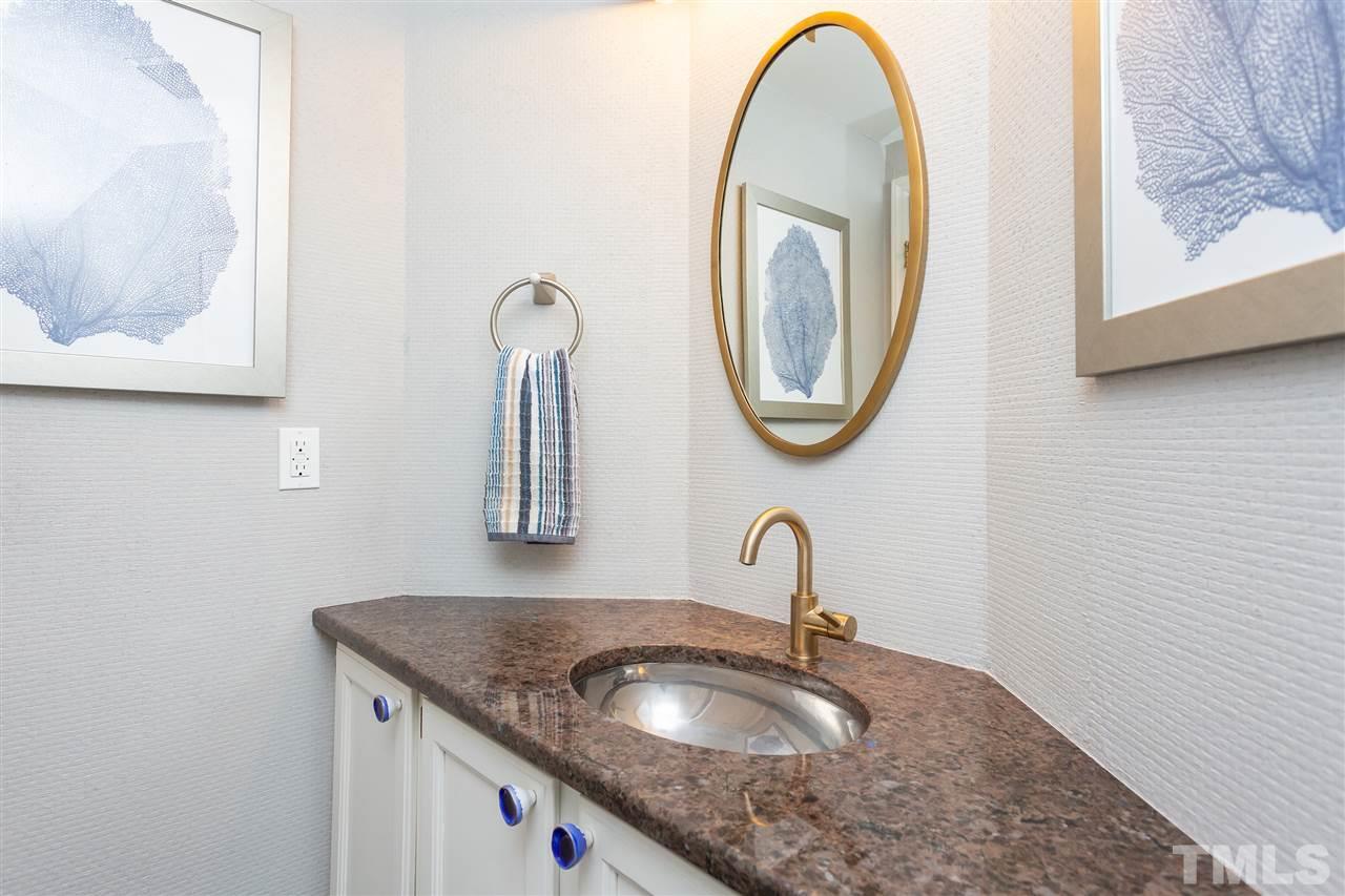 1462 Barton Pl Drive Raleigh, NC 27608 - Photo 14 of 25 a bathroom with a granite countertop sink and a mirror