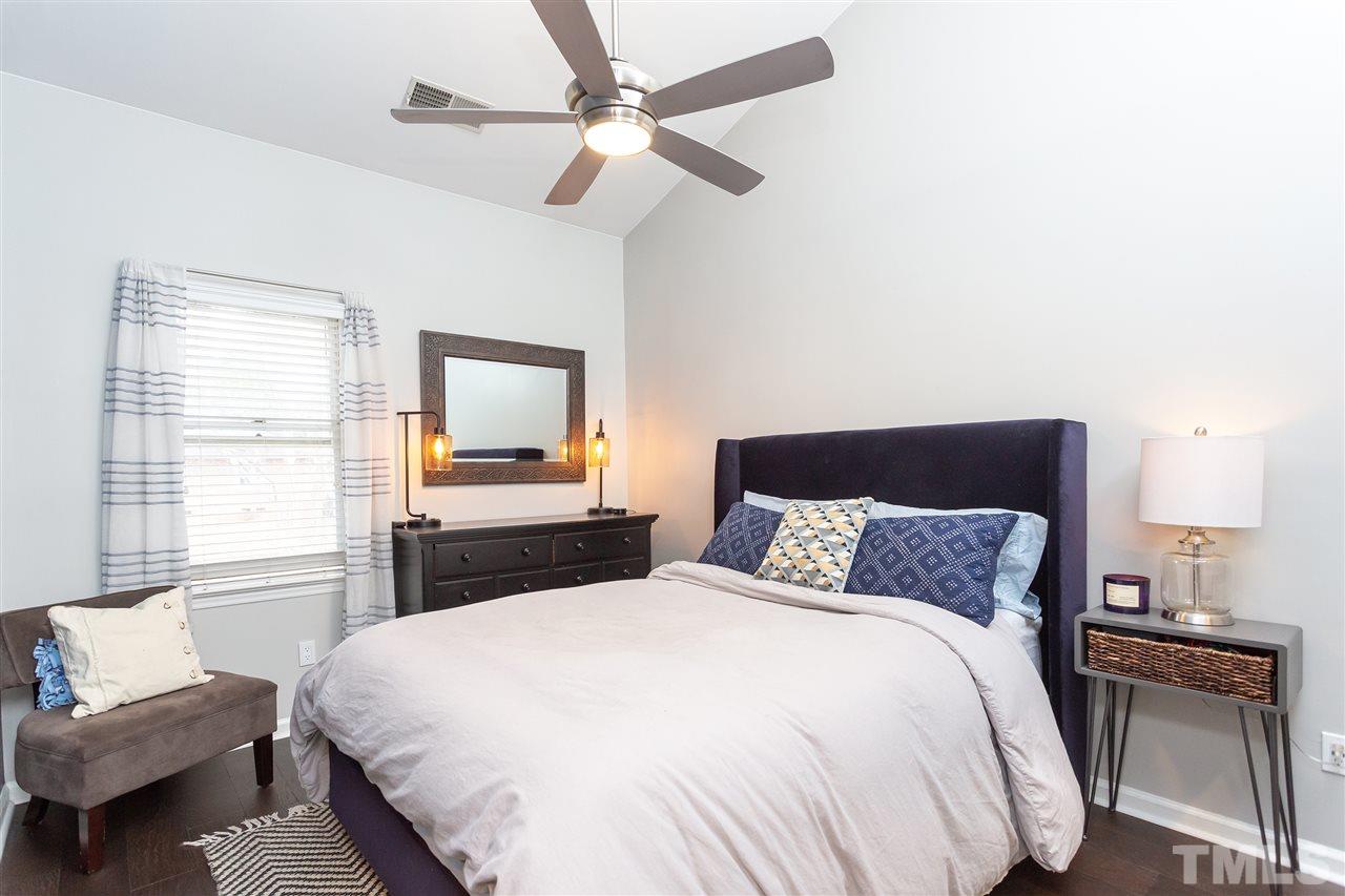 1462 Barton Pl Drive Raleigh, NC 27608 - Photo 18 of 25 a bedroom with a bed and a flat screen tv