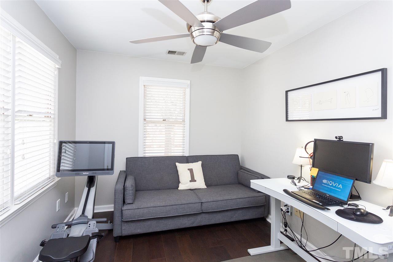 1462 Barton Pl Drive Raleigh, NC 27608 - Photo 22 of 25 a living room with furniture and a window
