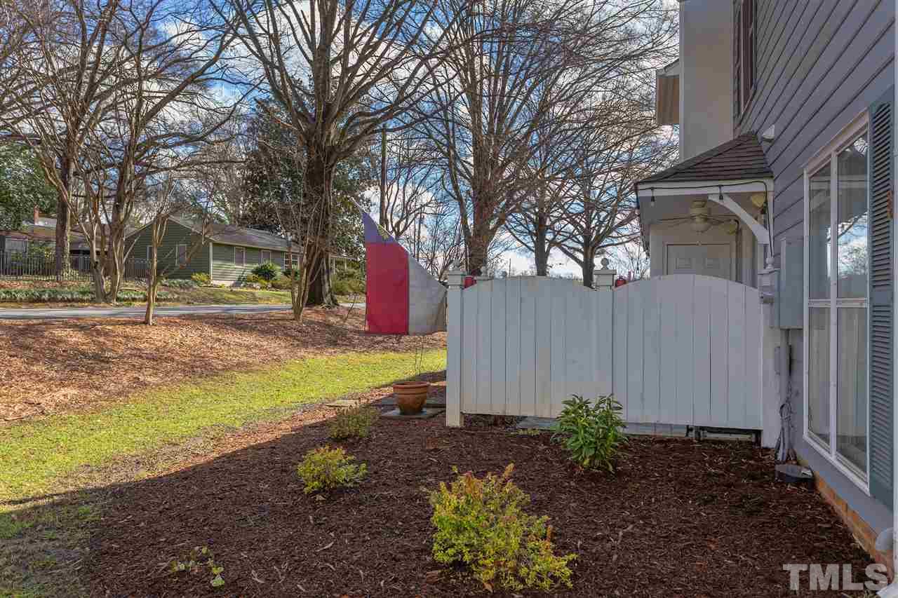 1462 Barton Pl Drive Raleigh, NC 27608 - Photo 24 of 25 a view of a house with backyard and tree