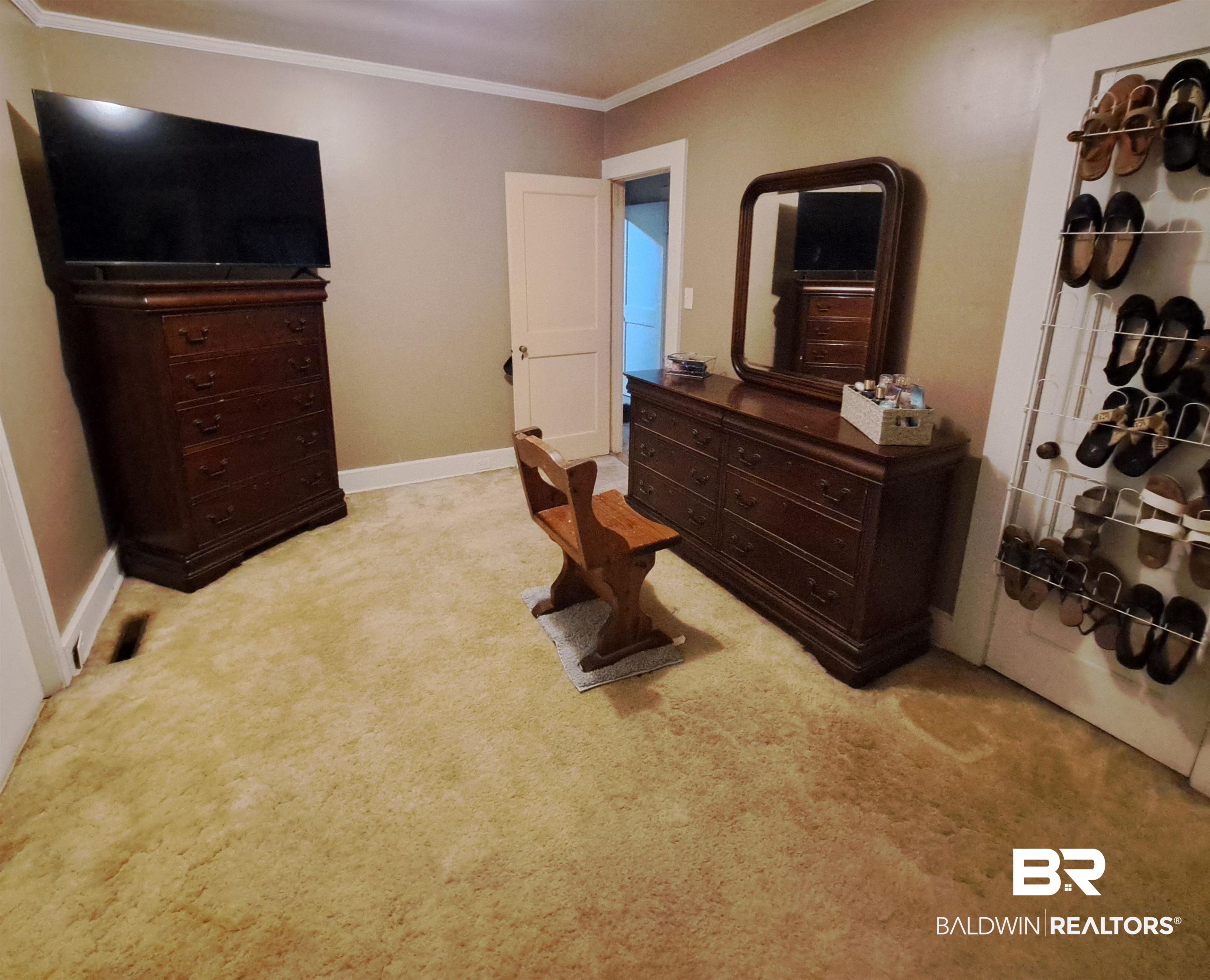 309 Bellview Avenue Evergreen, AL 36401 - Photo 19 of 27 Bedroom featuring ornamental molding and light colored carpet