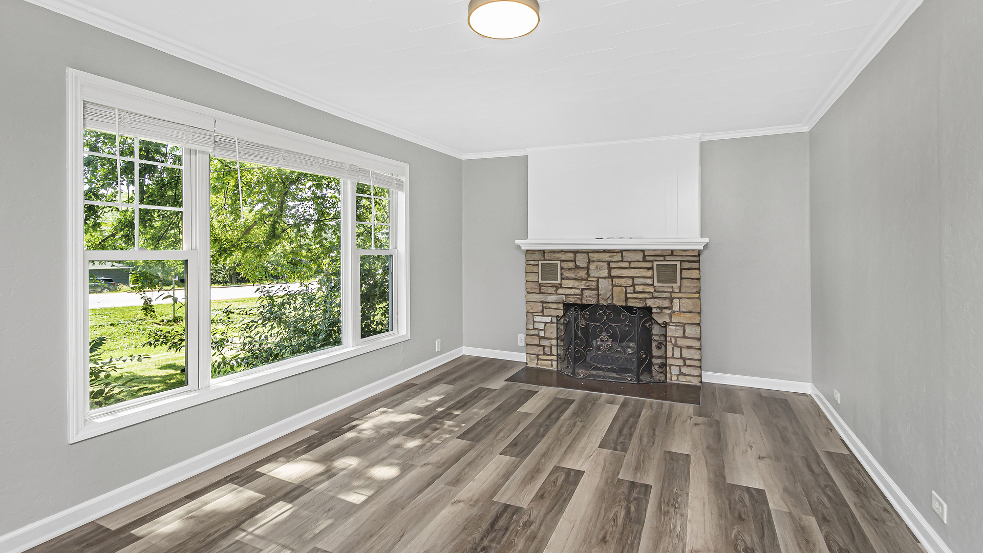 26058 West Rollins Road Ingleside, IL 60041 - Photo 5 of 18 wooden floor fireplace and windows in a room