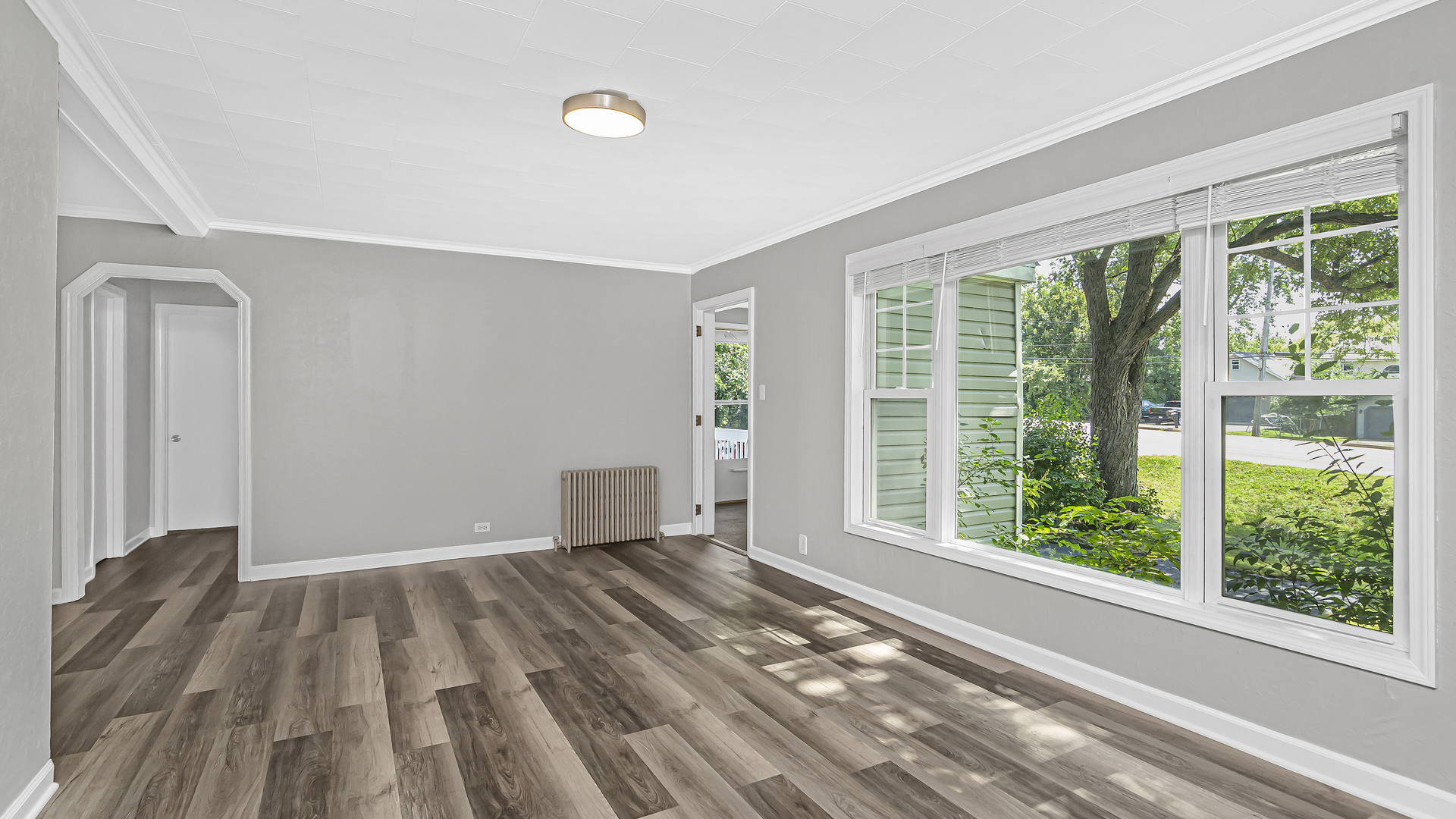 26058 West Rollins Road Ingleside, IL 60041 - Photo 6 of 18 a view of empty room with wooden floor and fan
