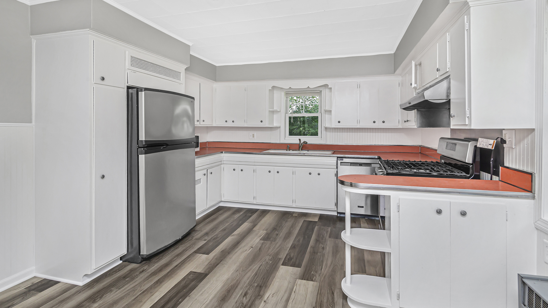 26058 West Rollins Road Ingleside, IL 60041 - Photo 8 of 18 a kitchen with a sink a stove a refrigerator and cabinets