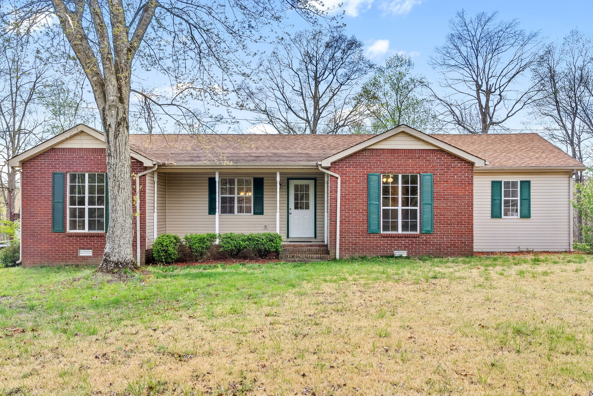 135 Carl Taylor Road Tennessee Ridge, TN 37178 - Photo 1 of 41 a front view of a house with garden