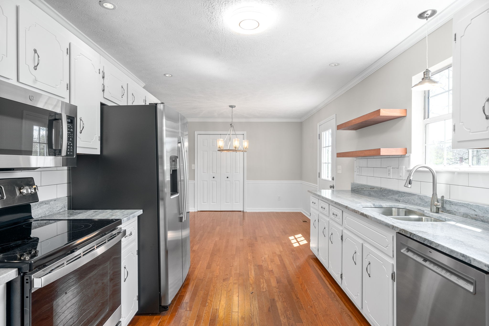135 Carl Taylor Road Tennessee Ridge, TN 37178 - Photo 12 of 41 a kitchen with a sink stove and refrigerator