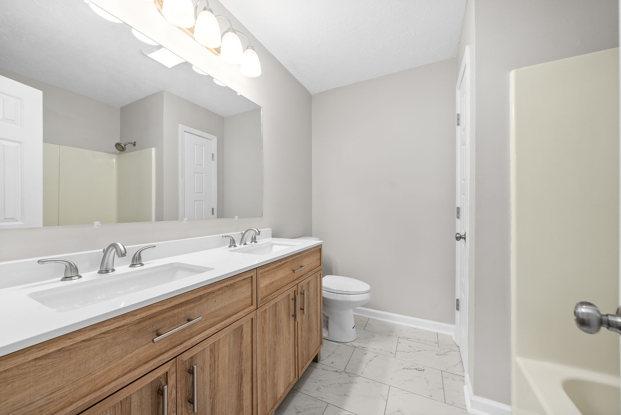 135 Carl Taylor Road Tennessee Ridge, TN 37178 - Photo 17 of 41 a bathroom with a sink a toilet and shower