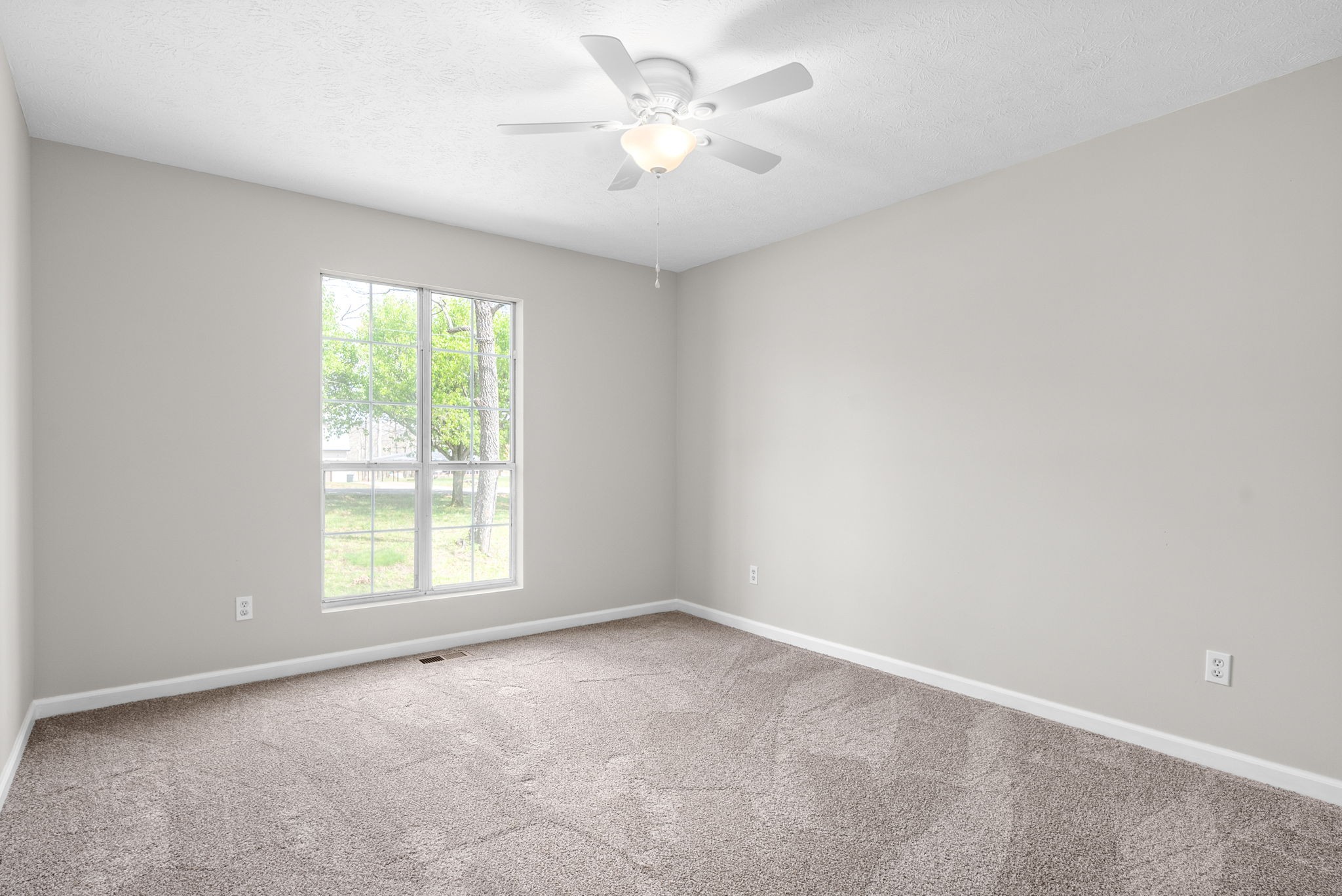 135 Carl Taylor Road Tennessee Ridge, TN 37178 - Photo 19 of 41 an empty room with a window and a fan