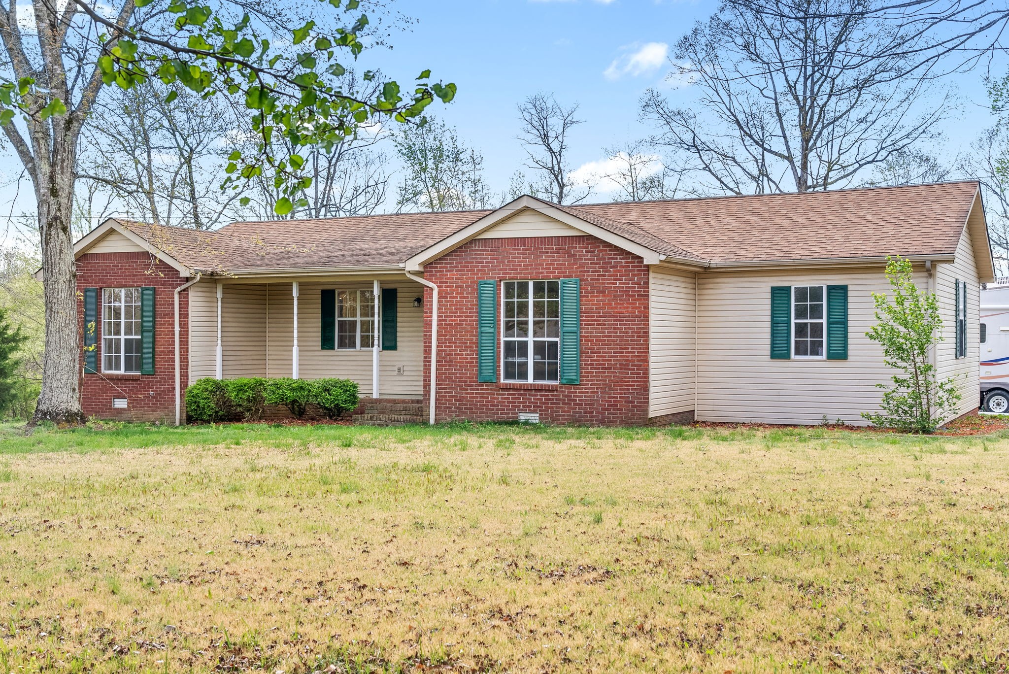 135 Carl Taylor Road Tennessee Ridge, TN 37178 - Photo 2 of 41 a front view of a house with a garden