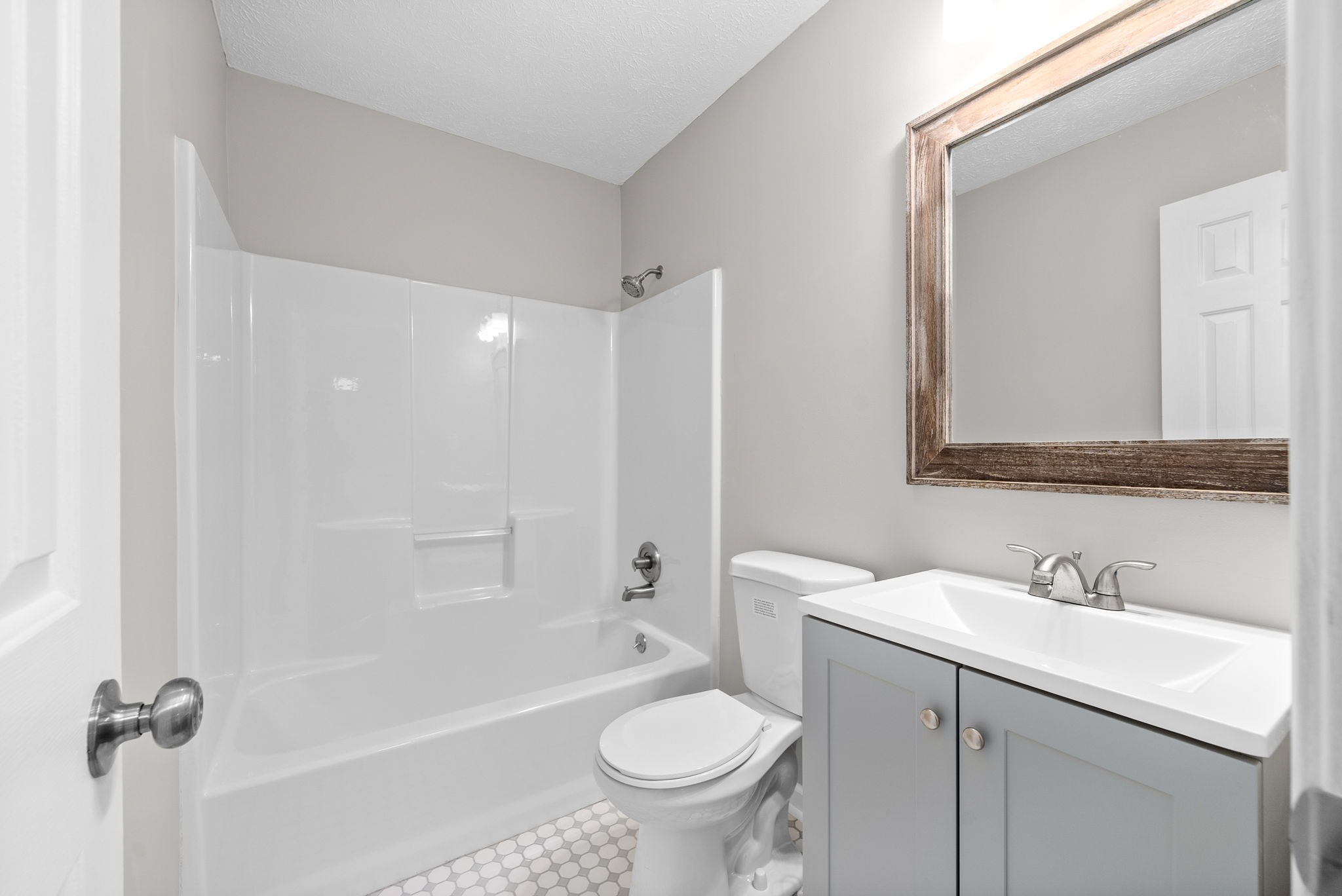 135 Carl Taylor Road Tennessee Ridge, TN 37178 - Photo 21 of 41 a bathroom with a sink a toilet and a mirror