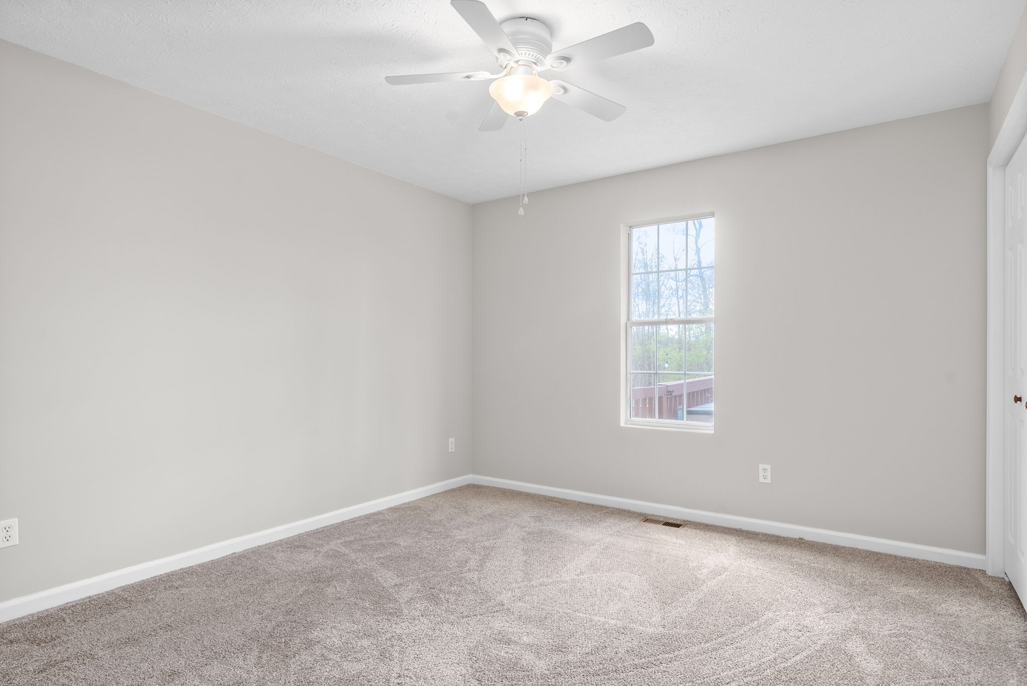 135 Carl Taylor Road Tennessee Ridge, TN 37178 - Photo 22 of 41 an empty room with a window and a fan