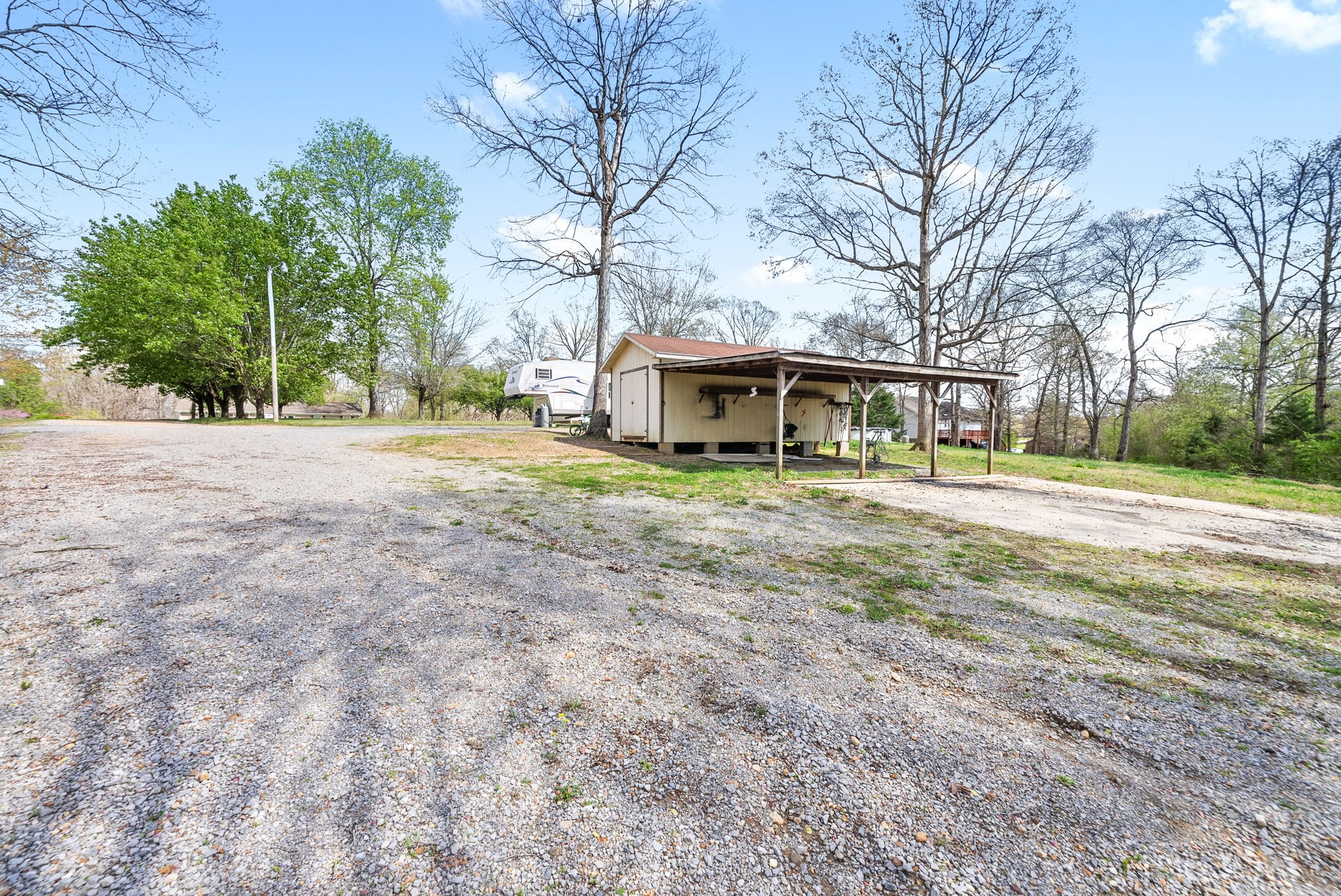 135 Carl Taylor Road Tennessee Ridge, TN 37178 - Photo 30 of 41 a view of a house with a yard and trees