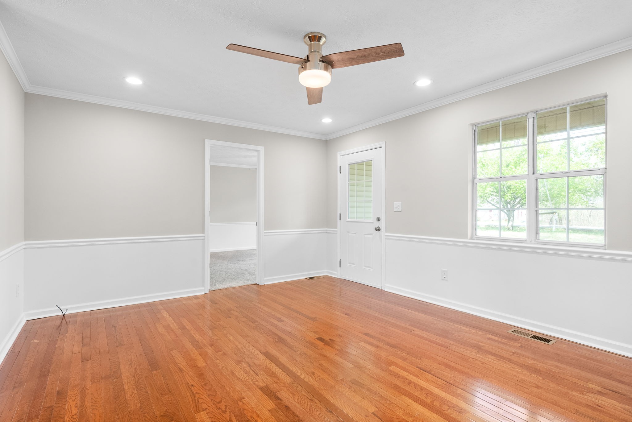 135 Carl Taylor Road Tennessee Ridge, TN 37178 - Photo 6 of 41 a view of empty room with wooden floor and fan