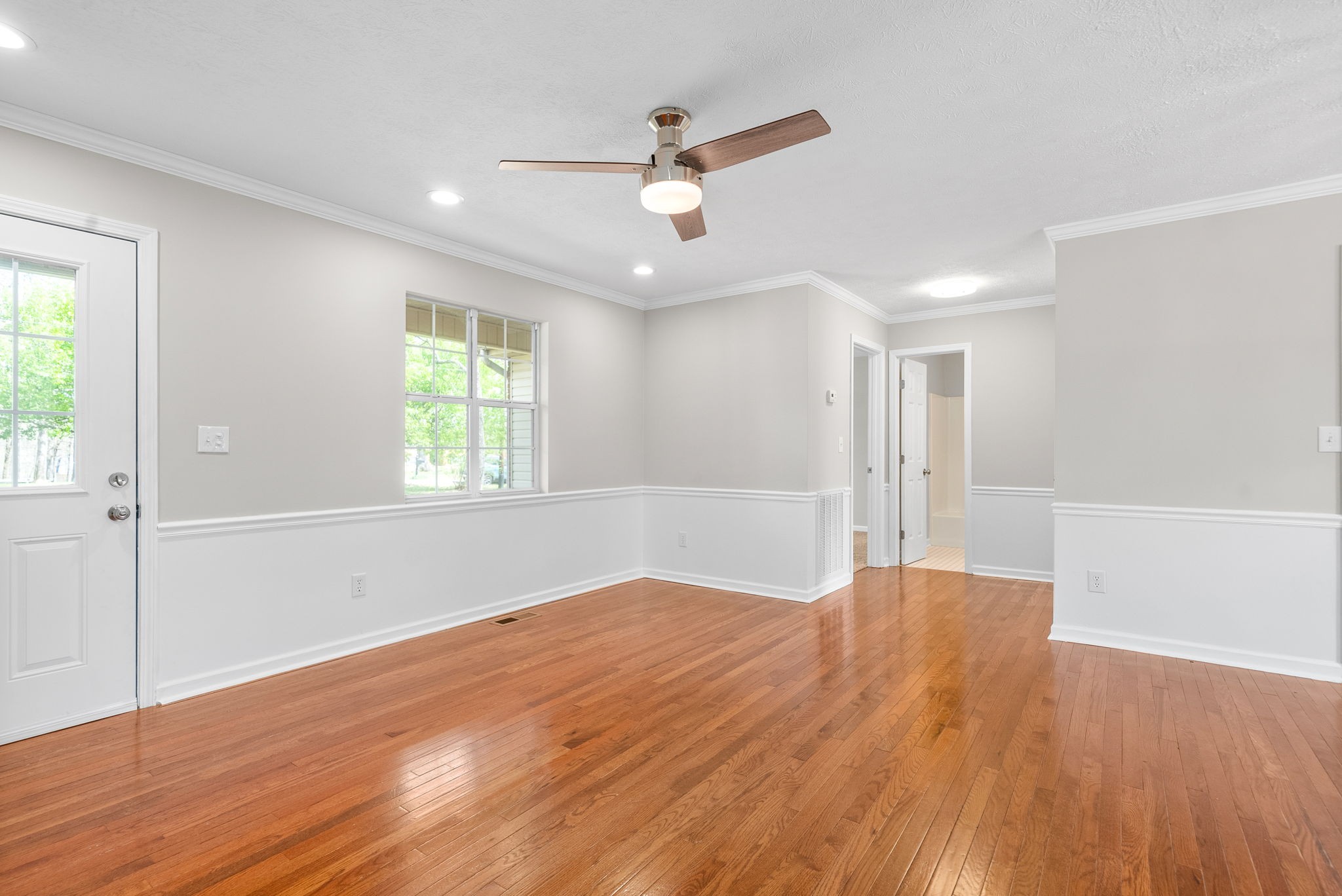 135 Carl Taylor Road Tennessee Ridge, TN 37178 - Photo 7 of 41 a view of empty room with wooden floor and fan