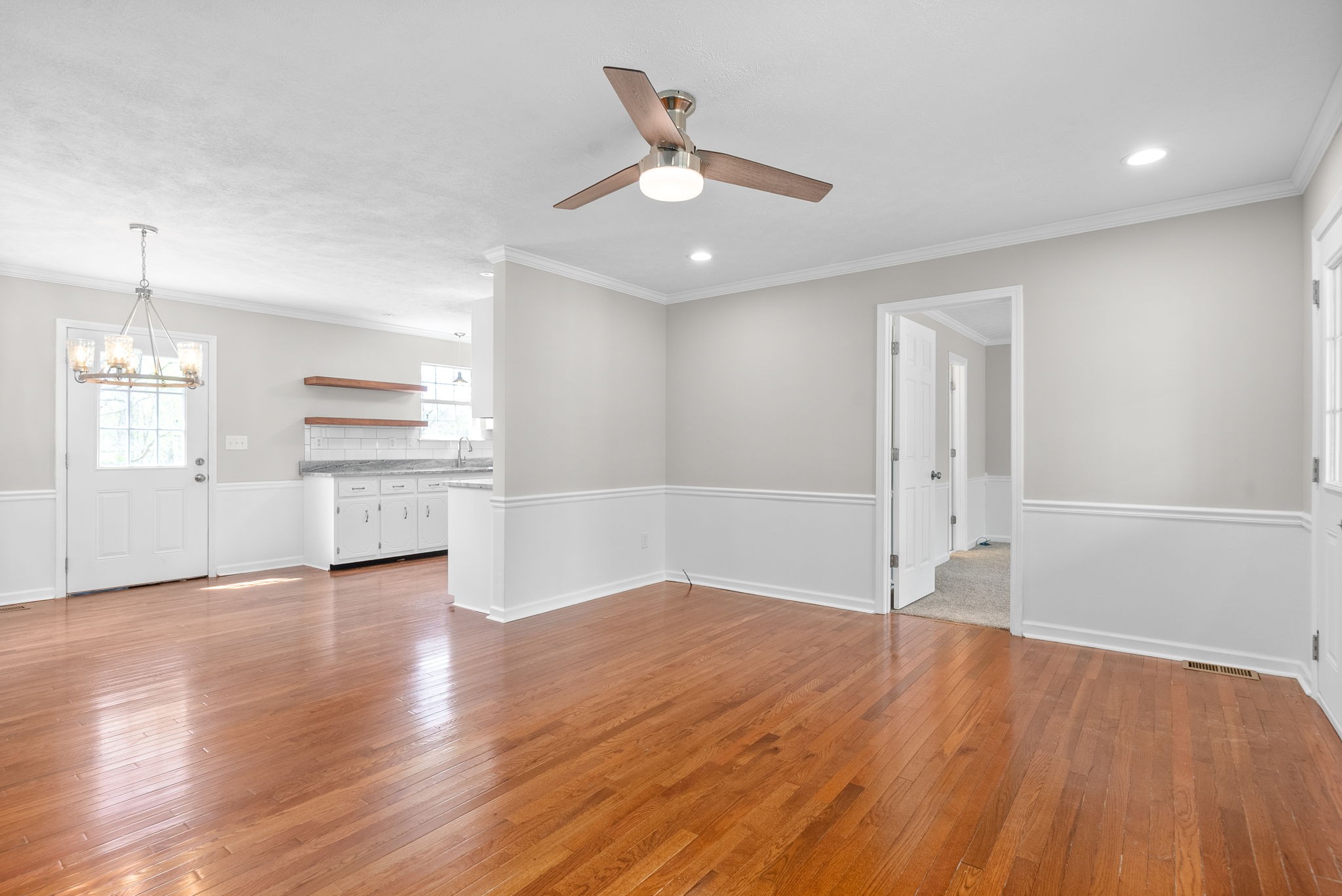 135 Carl Taylor Road Tennessee Ridge, TN 37178 - Photo 8 of 41 an empty room with wooden floor cabinet and windows