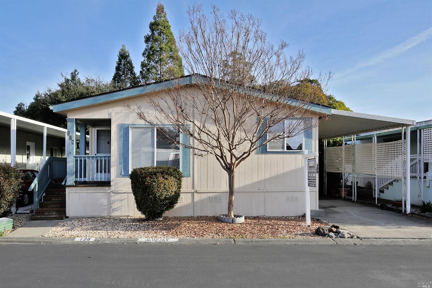 128 Bluejay Drive, Unit 131 Santa Rosa, CA 95409 - Photo 1 of 1 a backyard of a house with outdoor seating